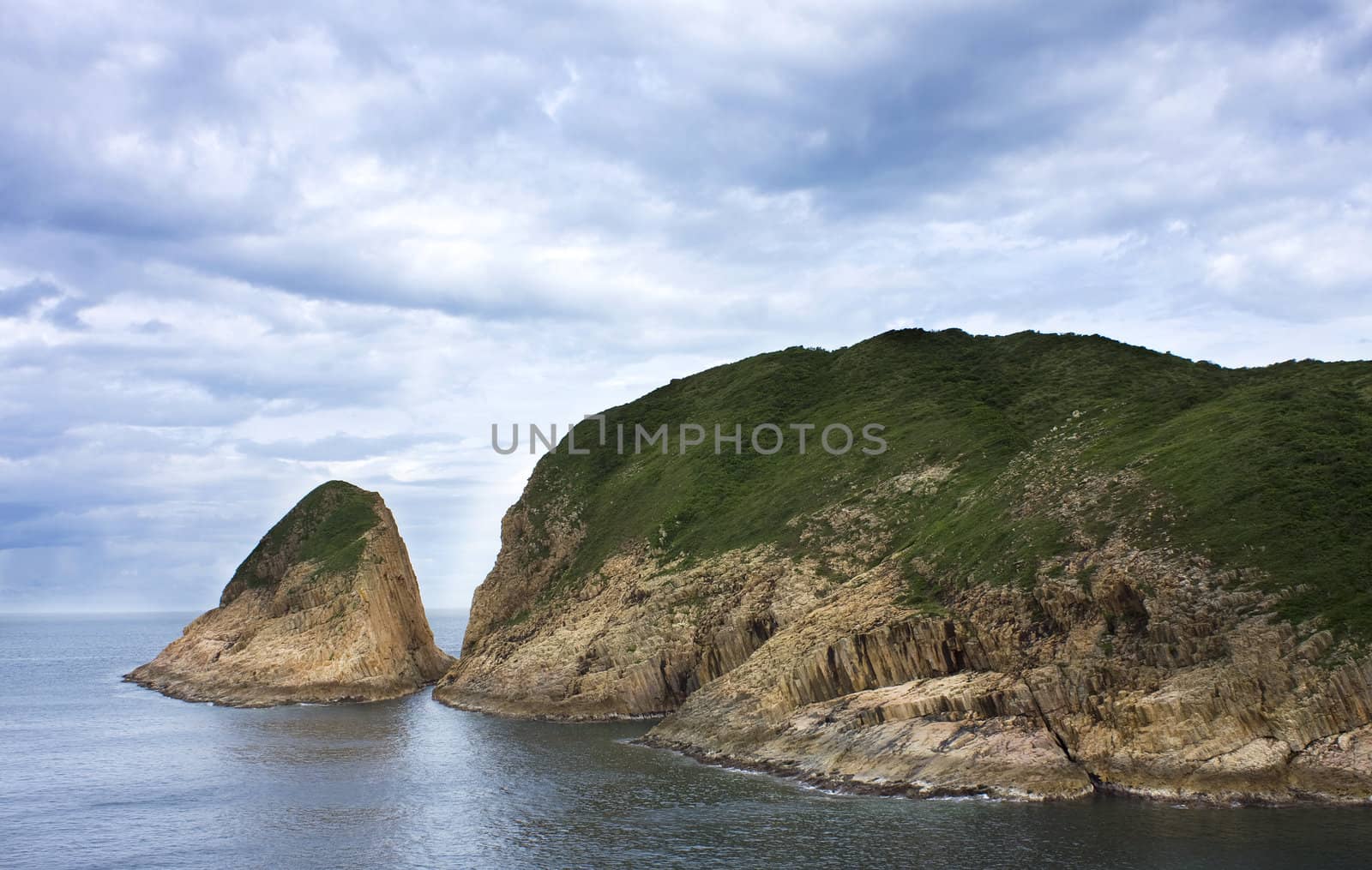 Sea harbor with blue water and blue sky with clouds 