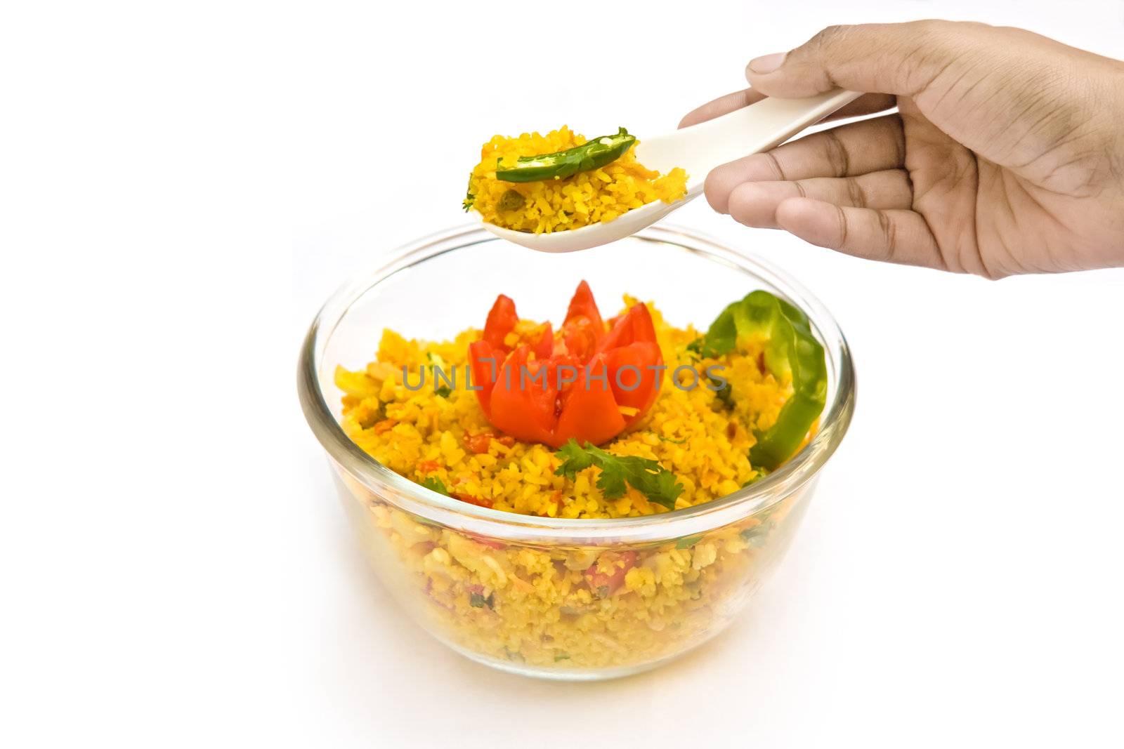 Decorating delicious food of rice and salad in beautiful bowl  