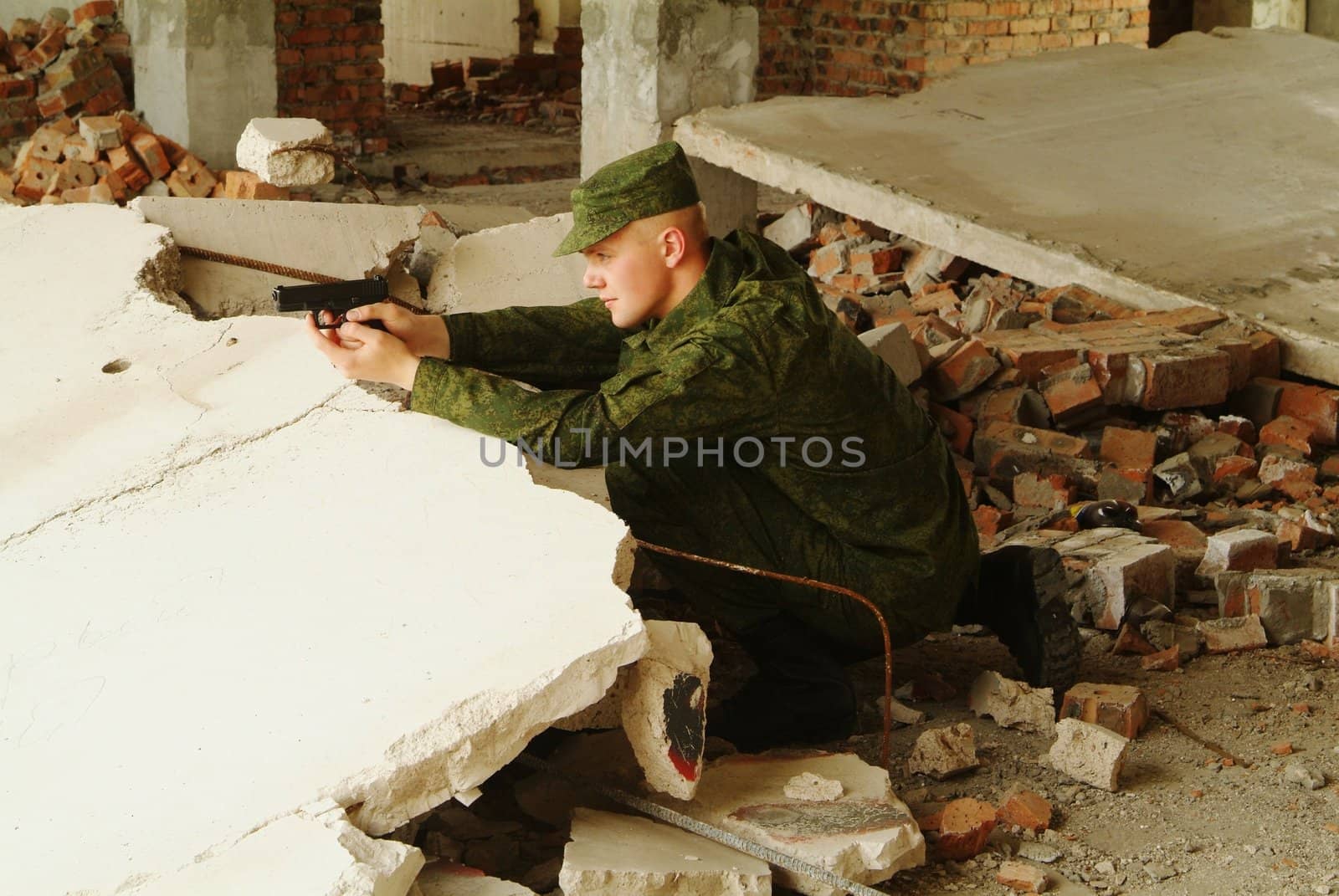 The soldier with a pistol performs antiterrorist operation. by palomnik