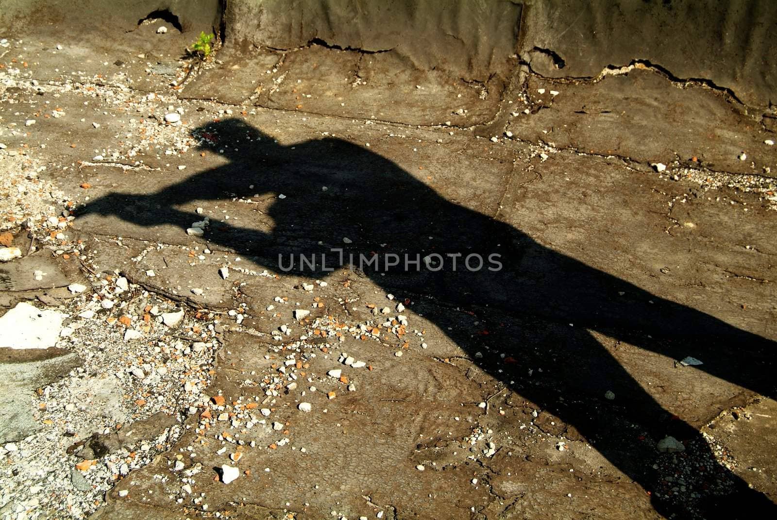 The Shadow of soldier with a gun