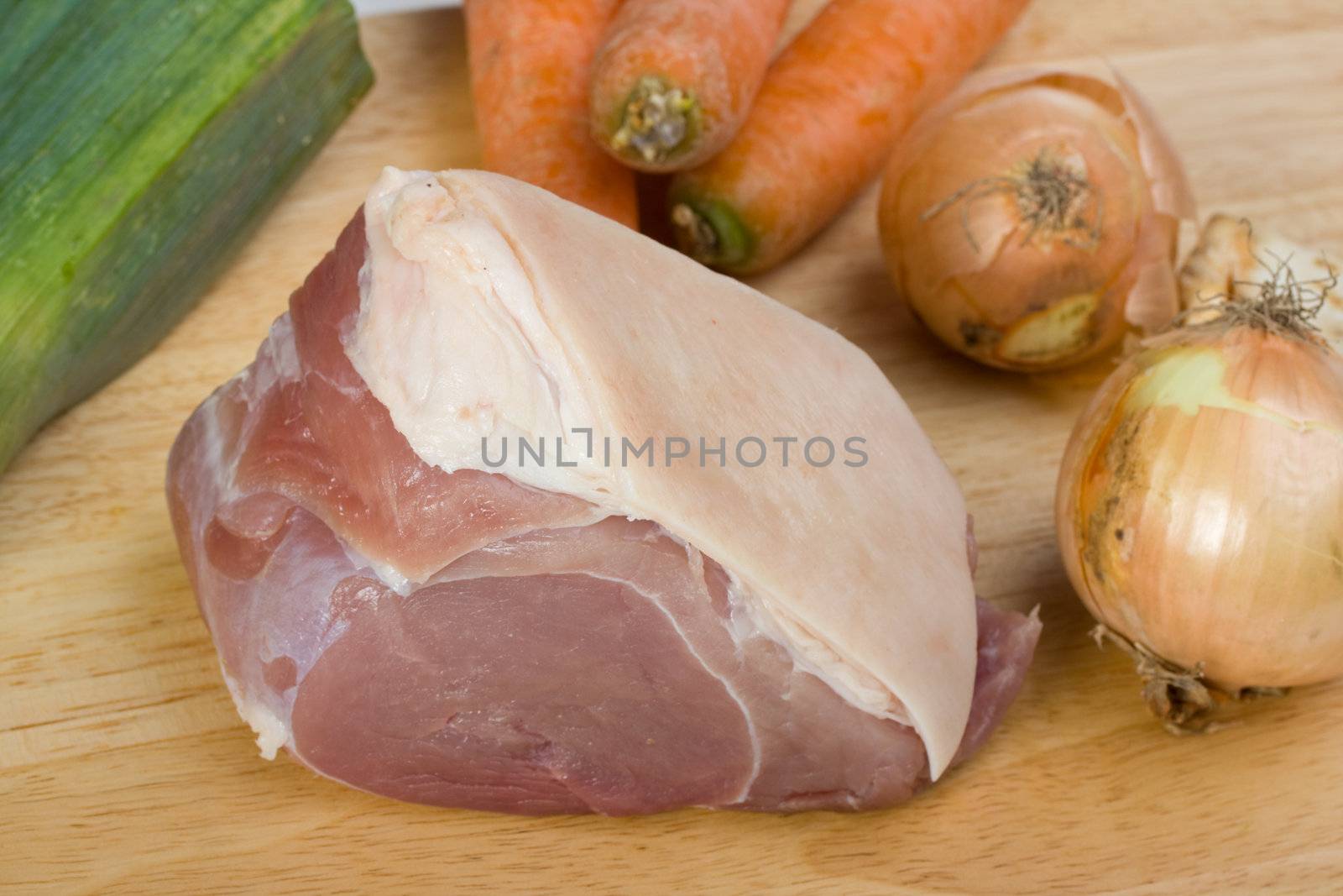 raw pork meat and sauce ingredients on a wooden plate