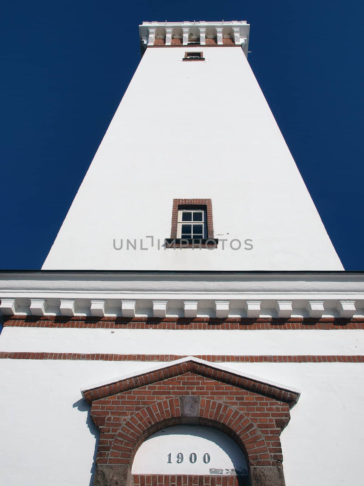 The lighthouse of Helnaes Denmark year built 1900 low perspective view           