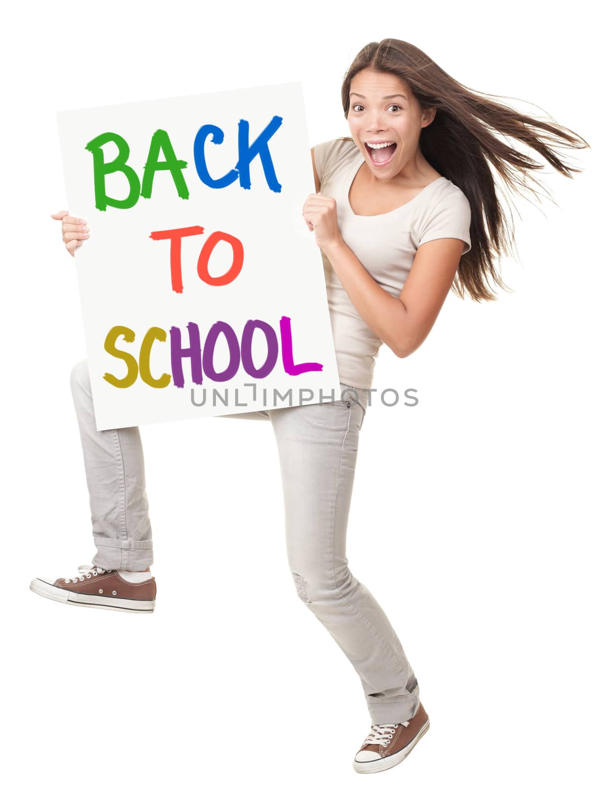 Back to school / university / college. Female student holding a sign saying Back to School. Happy excited screaming white / chinese woman isolated on white background in full length