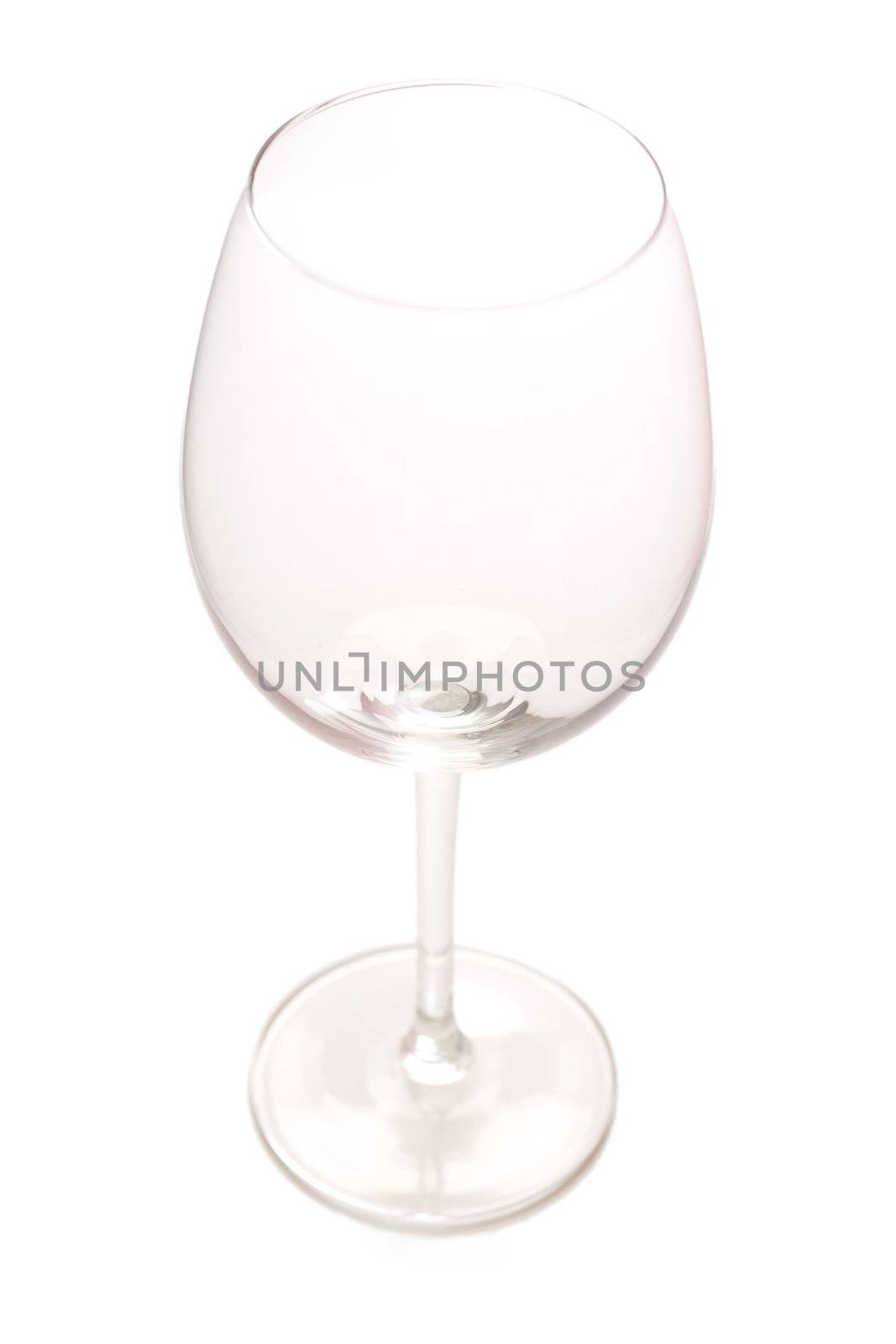 Empty wine glass isolated on white