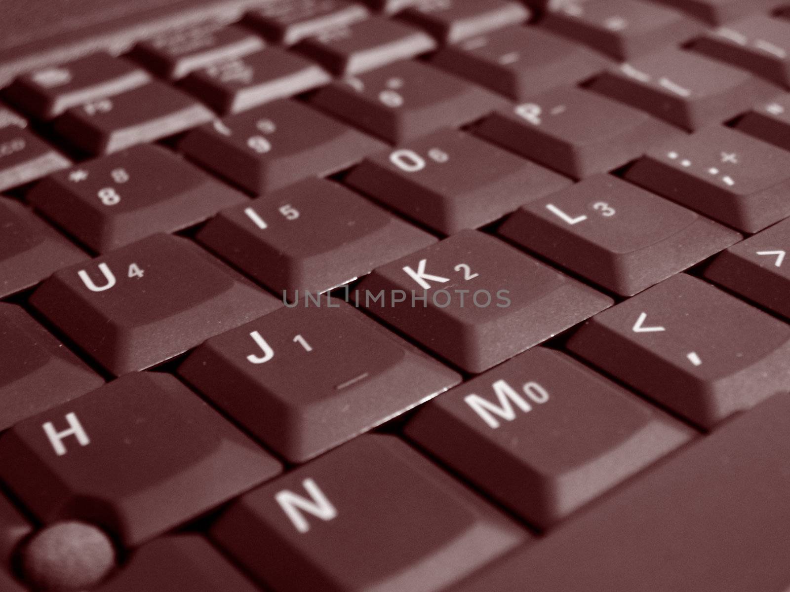 A close up shot of some keys on a laptop keyboard.