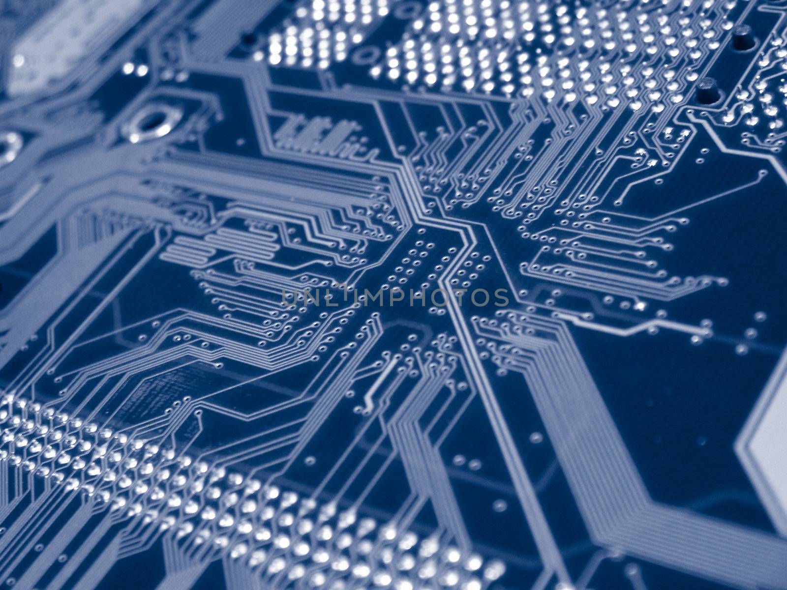 A shot of the back side of a new dual processor computer mother board.  This image is a nice background image for print material related to computer technology.