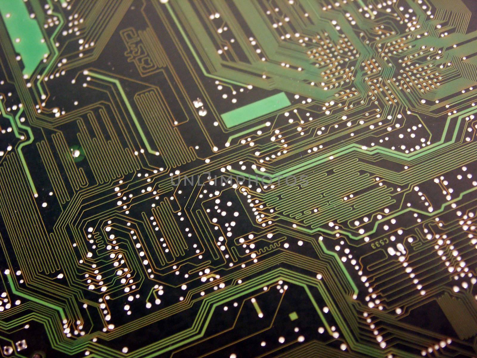 A shot of the back side of a new dual processor computer mother board. This image was used to create a background and a logo for a computer company's website. This image is also a nice background image for print material related to computer technology.