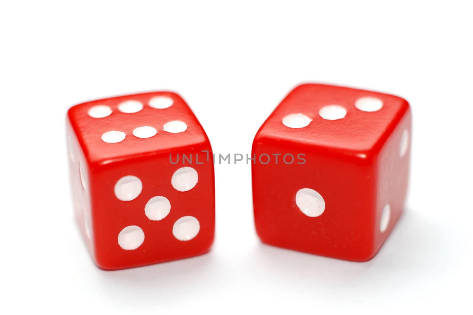 Two red dice isolated on white background