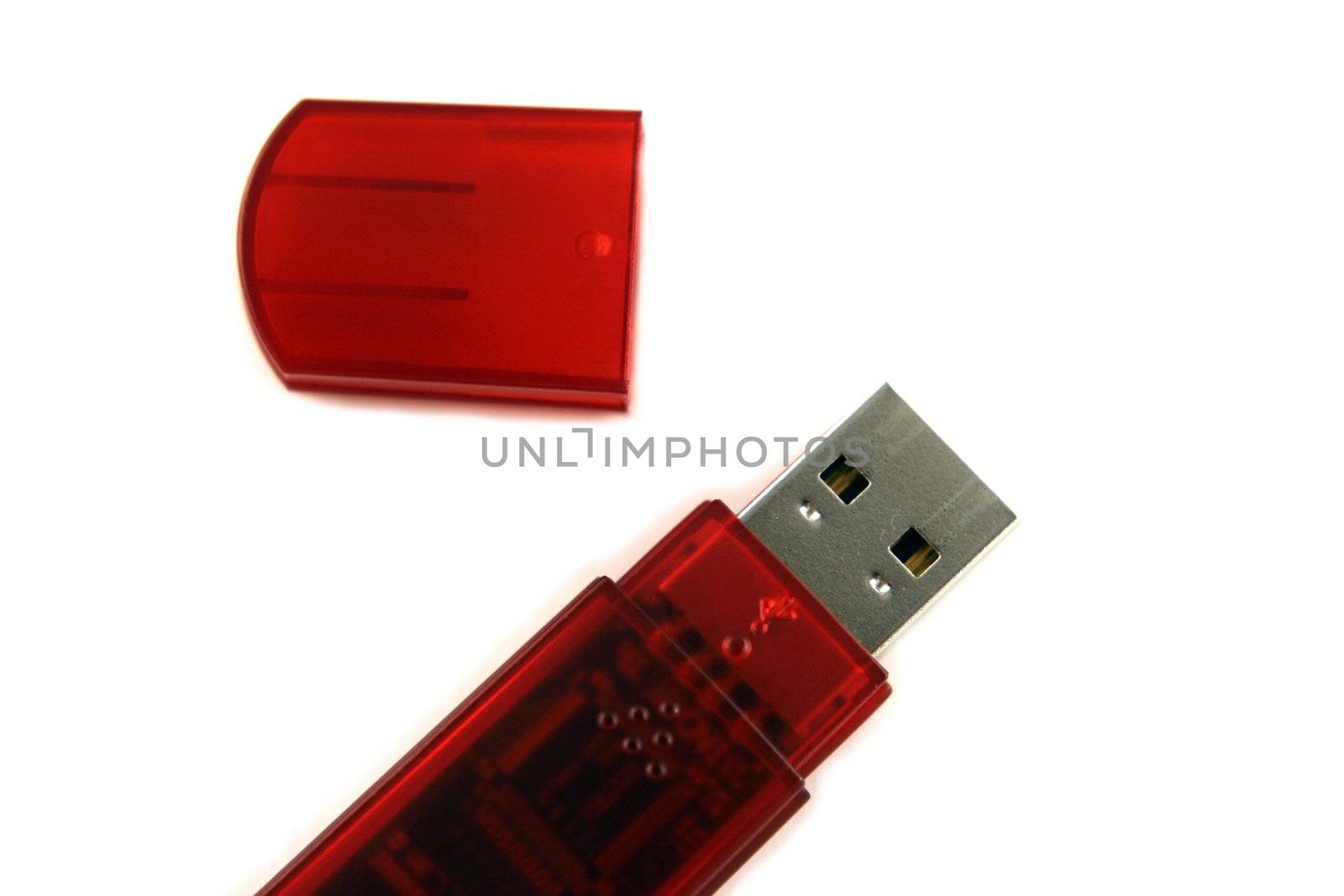 a usb pen drive with the cap off isolated on white