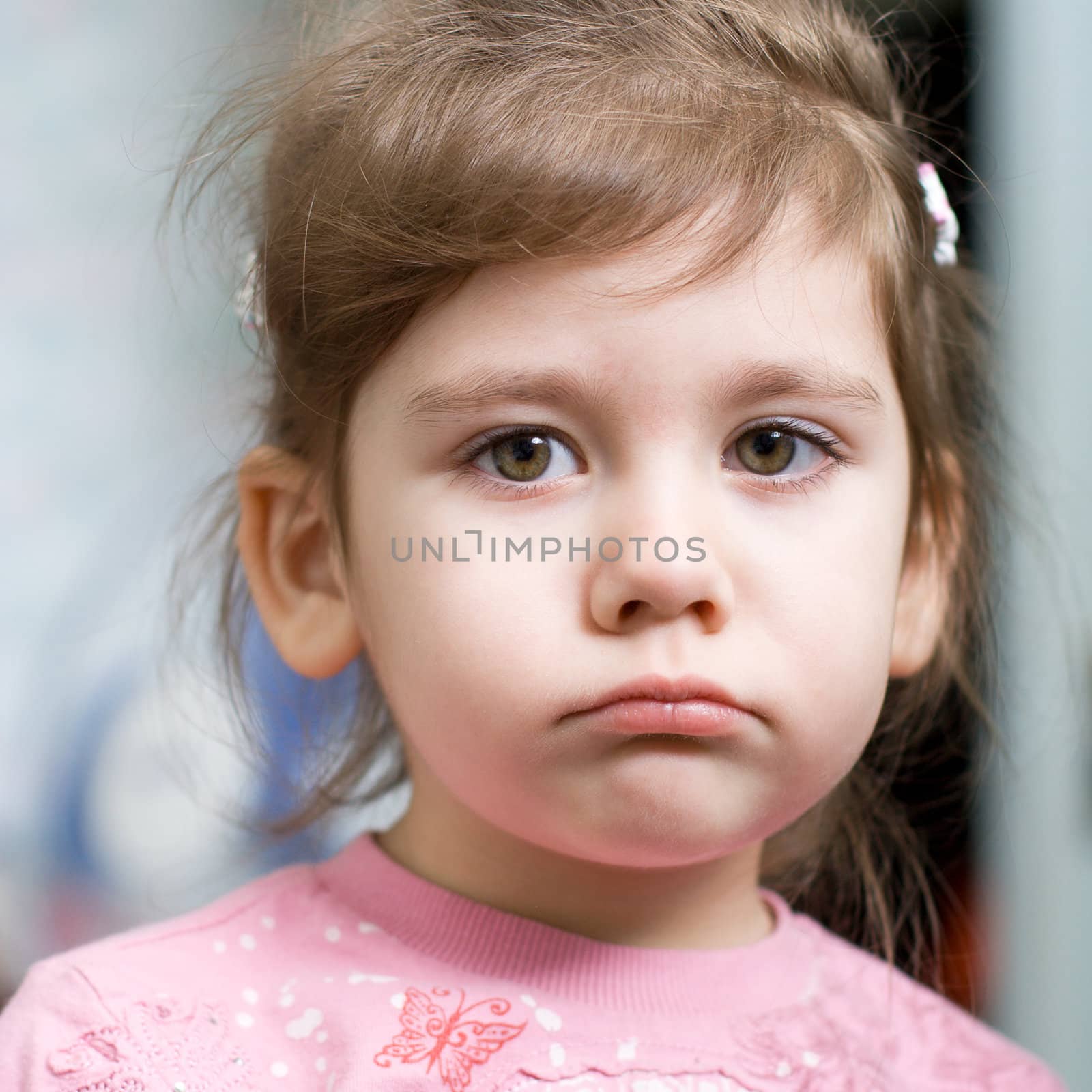 portrait of a disappointed little girl