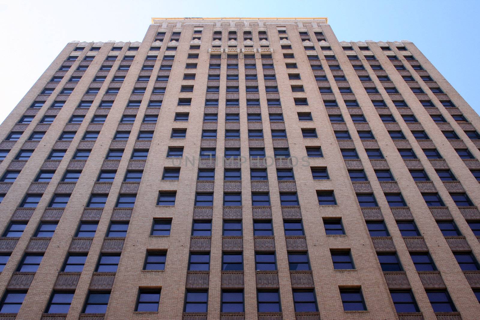 A tall skyscraper view from below.  Taken on a nice bright day.  Image has a lot of detail.