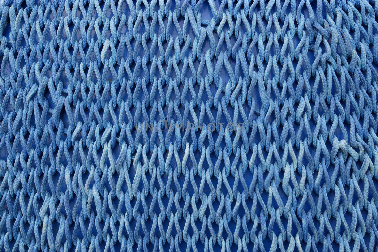 Photo of blue netting as a background.