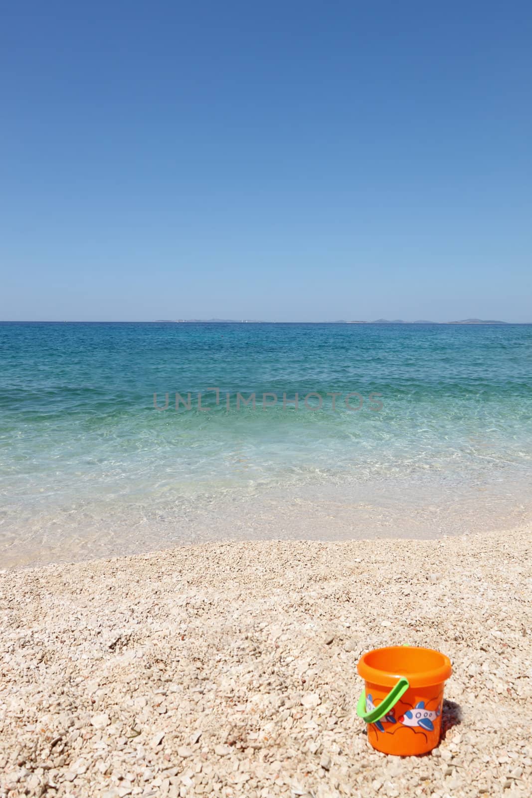 beautiful beach with child's bucket in Croatia