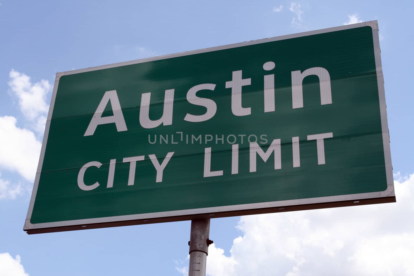 An Austin City Limit road sign close up.