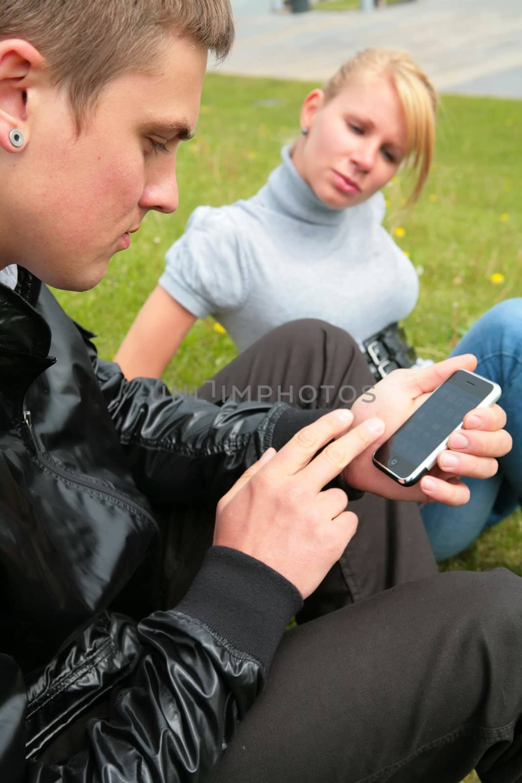 young man keeps in hand computer device und girl was conceived