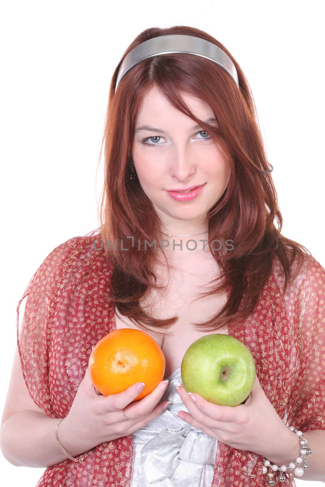 Pretty woman with green apple and orange, with copy-space