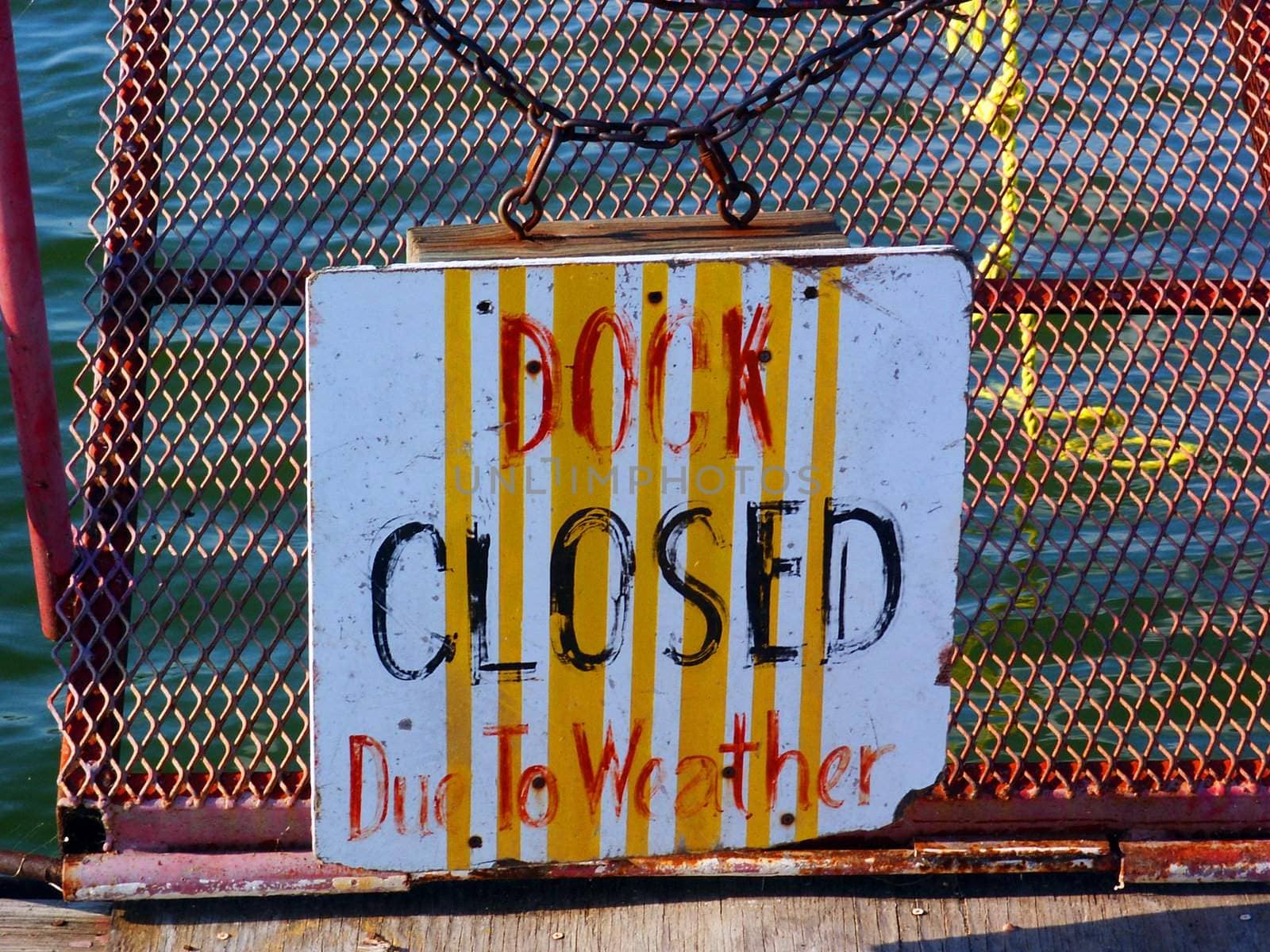 A "Dock Closed Due To Weather" sign.