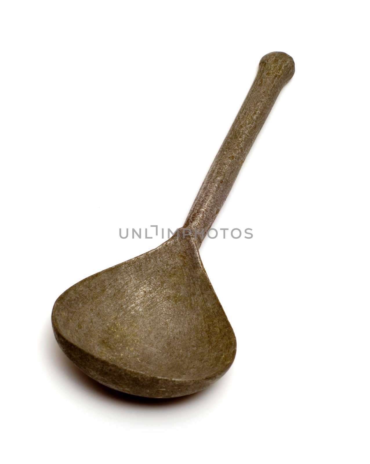 The old tin spoon isolated on white background.