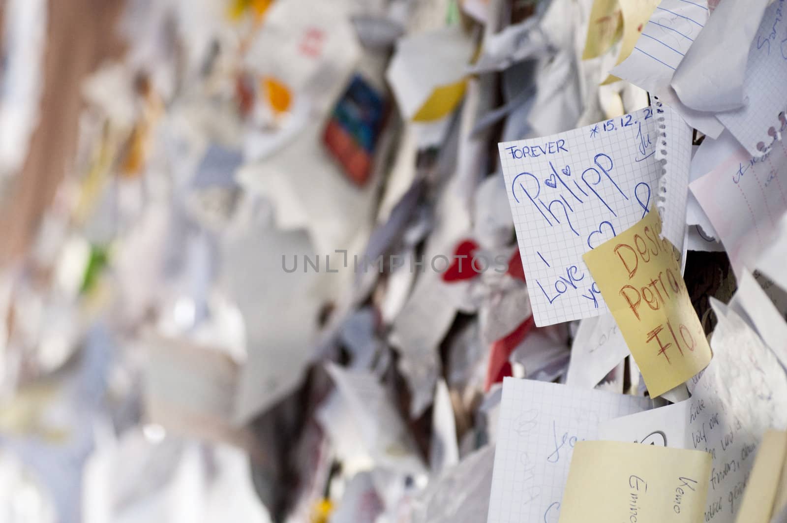 Tickets of love hanging from a wall