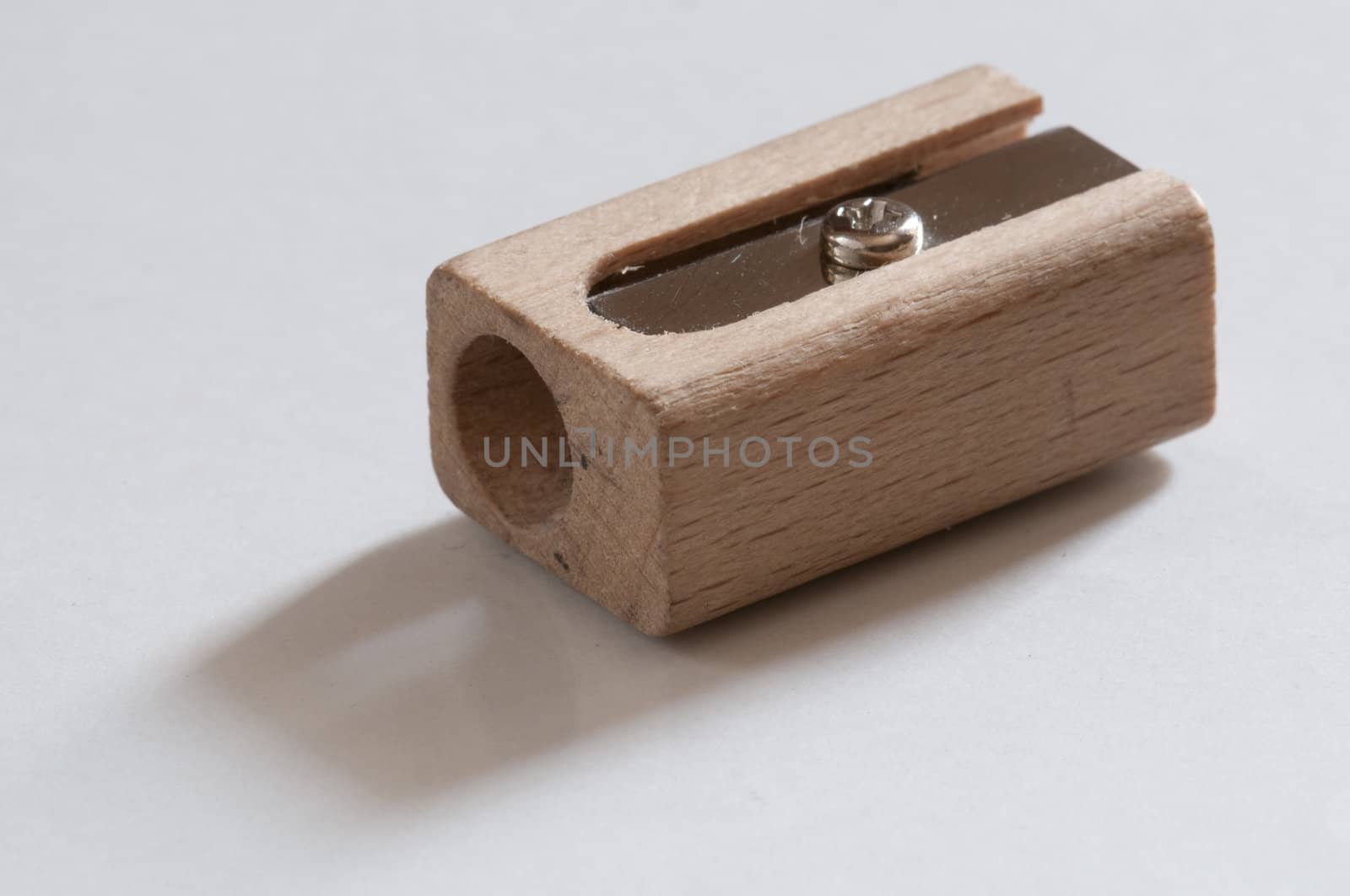 isolated wooden pencil shapener on white background