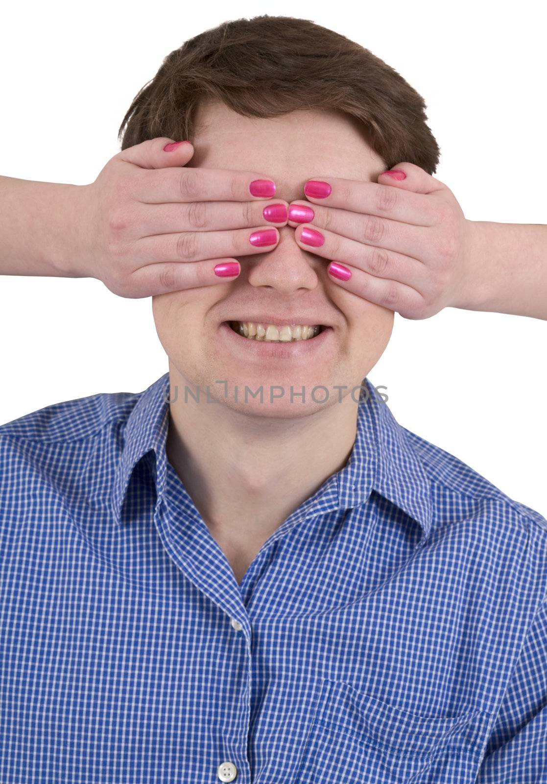 Man with covered eyes female hands on white