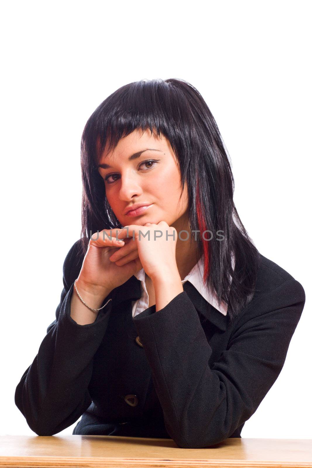 Young business woman sitting at the table looking at you