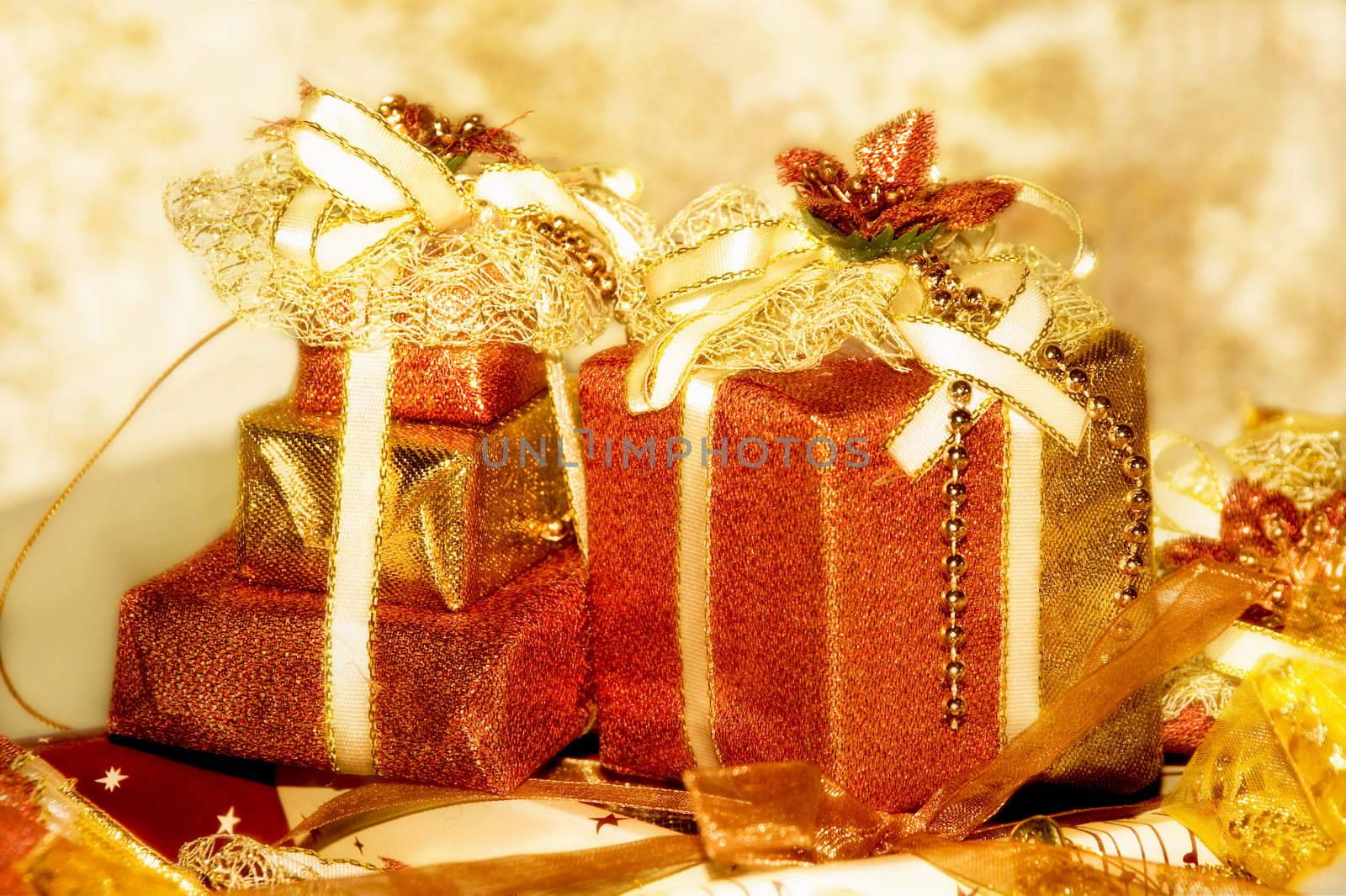 Golden gift boxe. Are tied up by tapes with bows