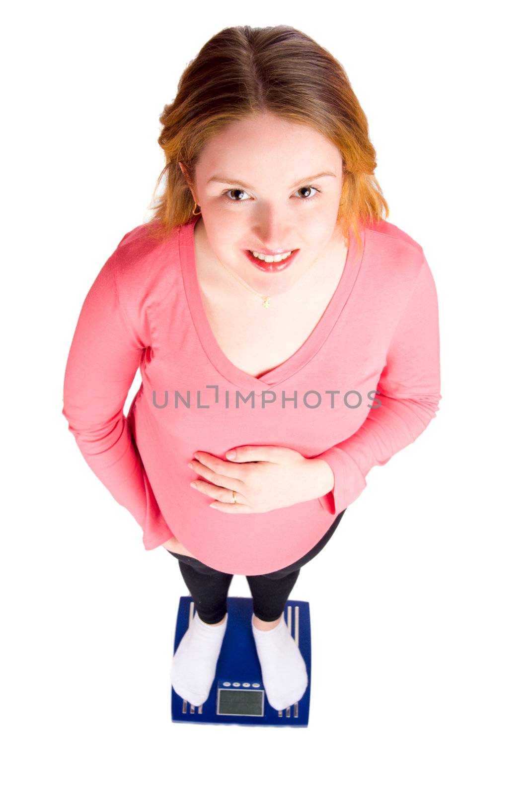 pregnant woman standing on scales isolated on white