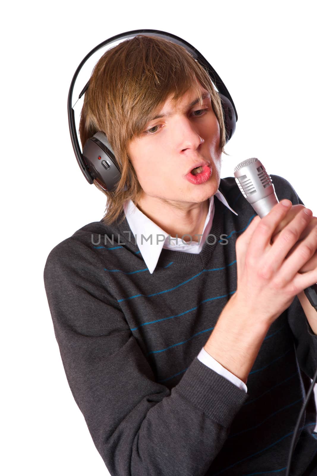 Young man singing wearing headphones isolated on white
