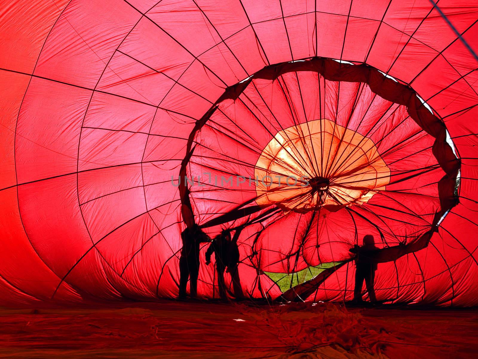 View of the inside of a red hot air balloon being infalated