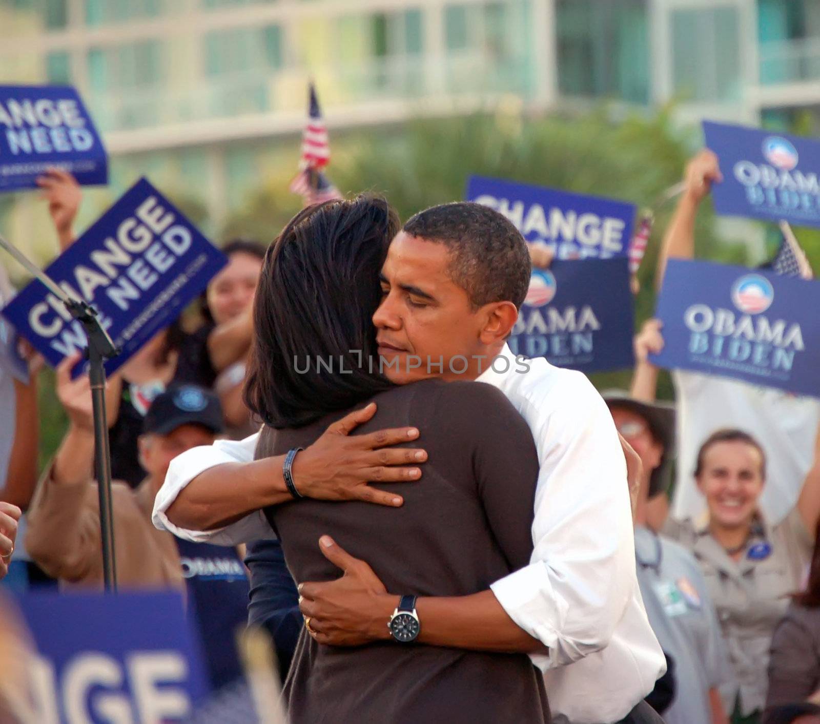 Barack Obama hugging his wife Michele after being introduced by her to a crowd of over 30,000 supporters at a rally in Bay Front Park,Miami,Florida in October 2008