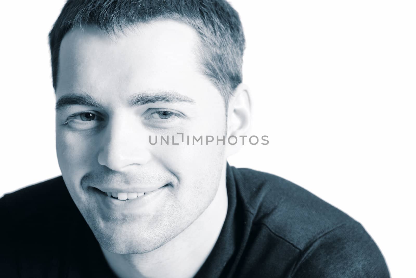 Smiling Young man's face closeup isolated 