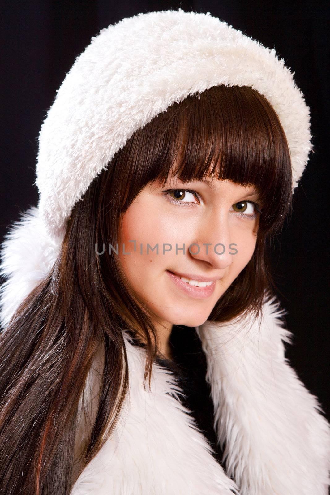 Young woman wearing white hat over black
