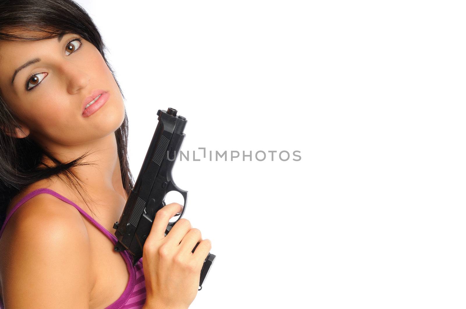 attractive young hispanic woman on a white background holding a pistol