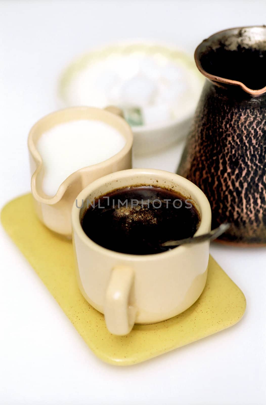 Coffee-set with a spoon in the cup