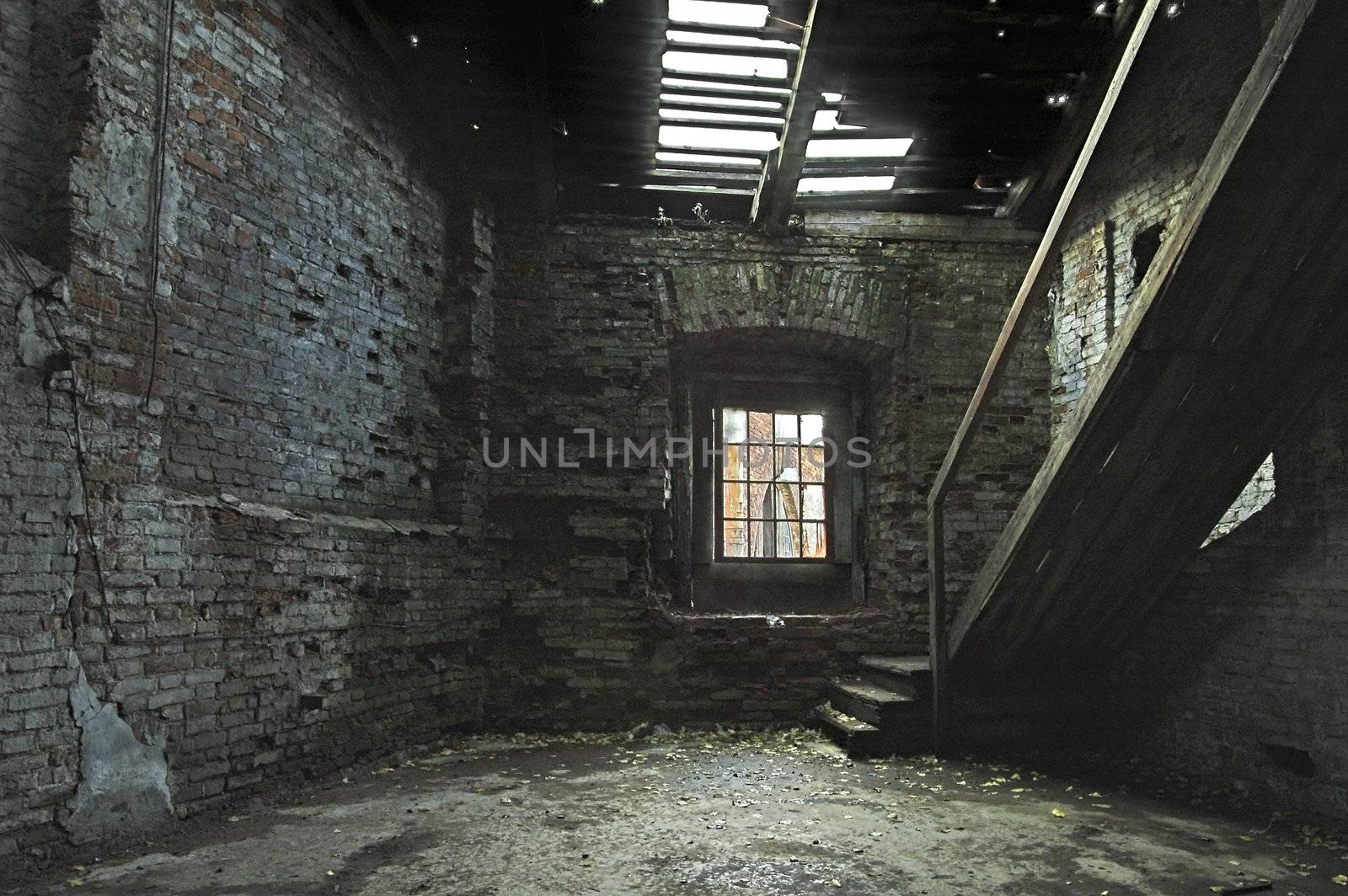 Abandoned store house hall with a staircase.