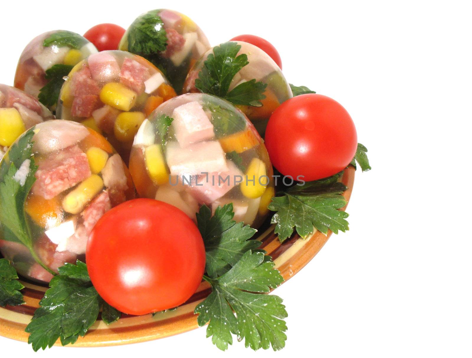 Appetizing jellied eggs with greens and tomatoes on a white background, with clipping path