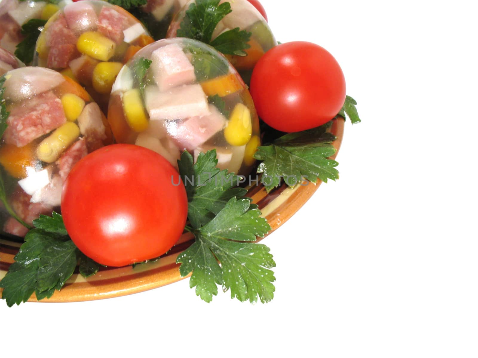 Appetizing jellied eggs with greens and tomatoes on a white background