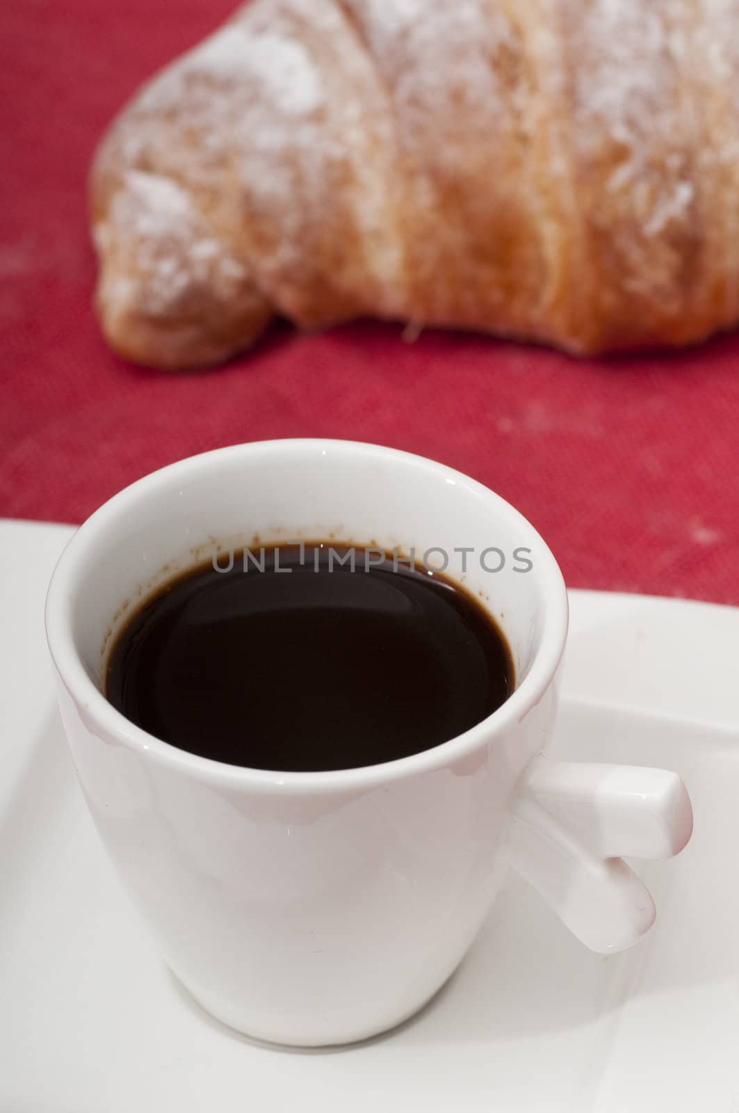 Continental breakfast with espresso coffee and a croissant