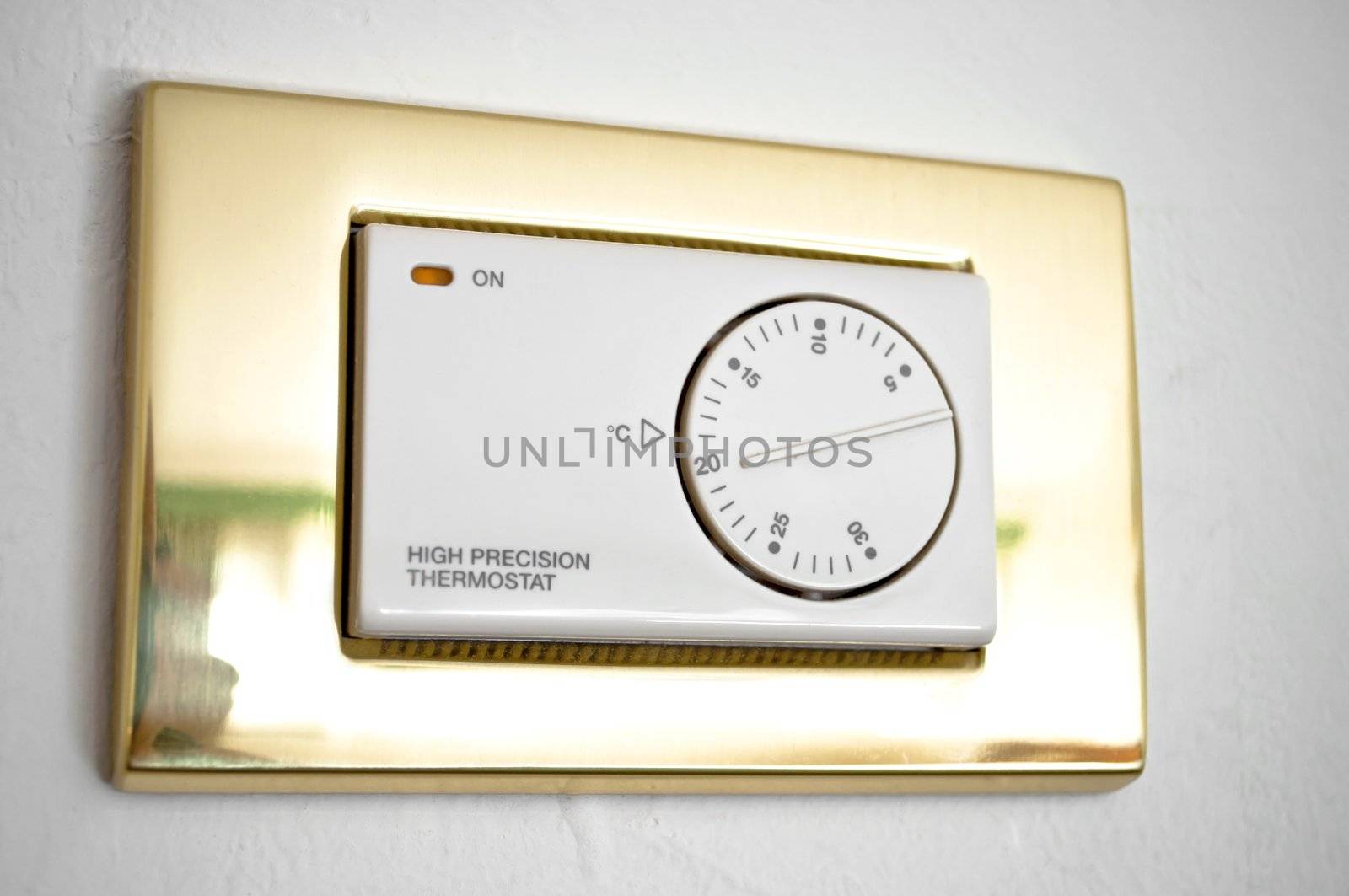 High precision thermostat on a white wall