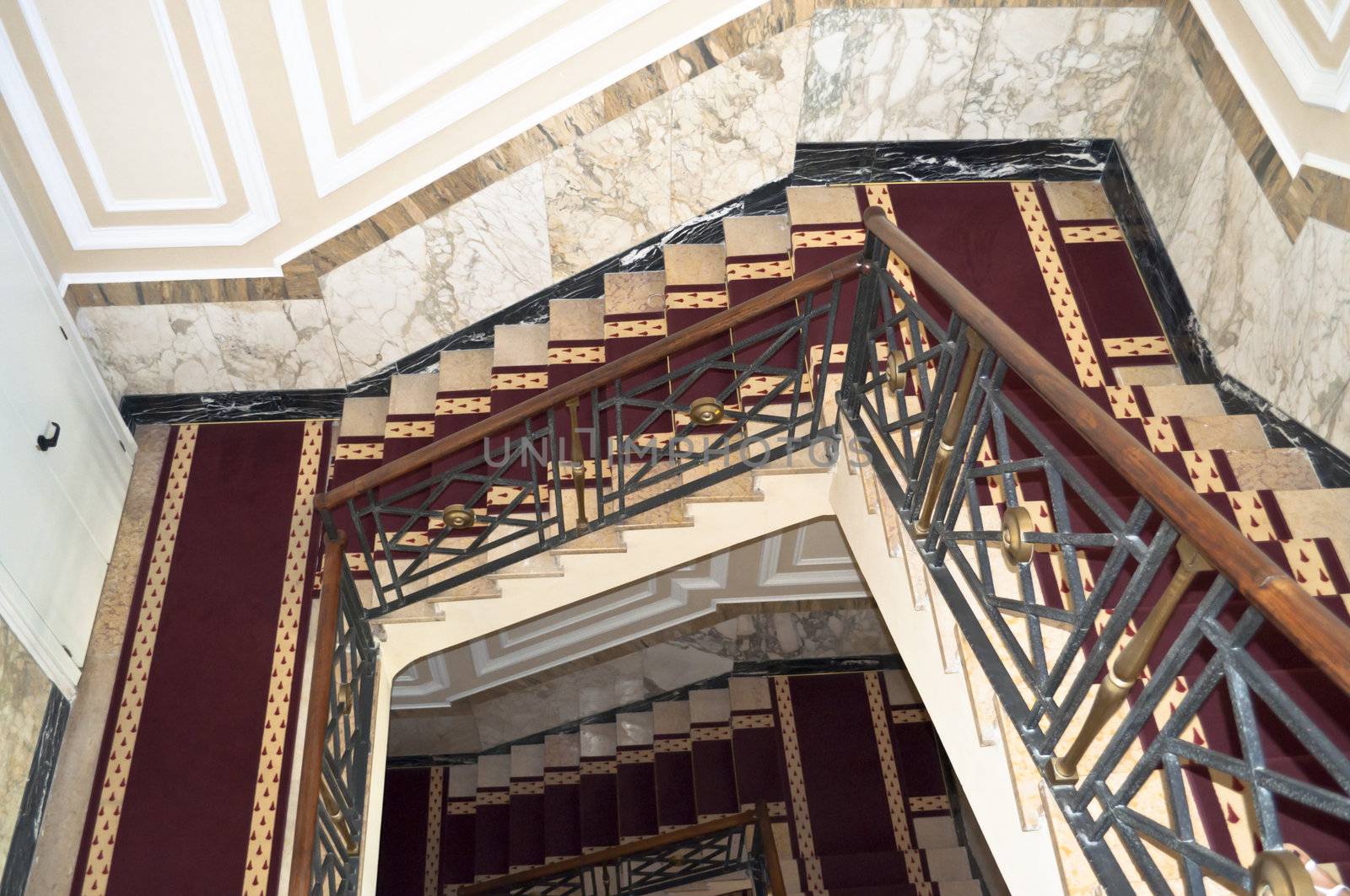 Classical marble staircase in ancient hotel structure