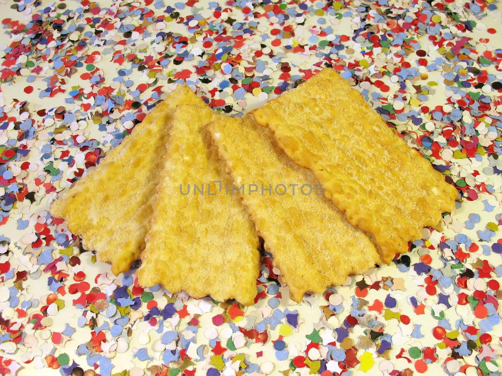 Carnival cakes on background of confetti