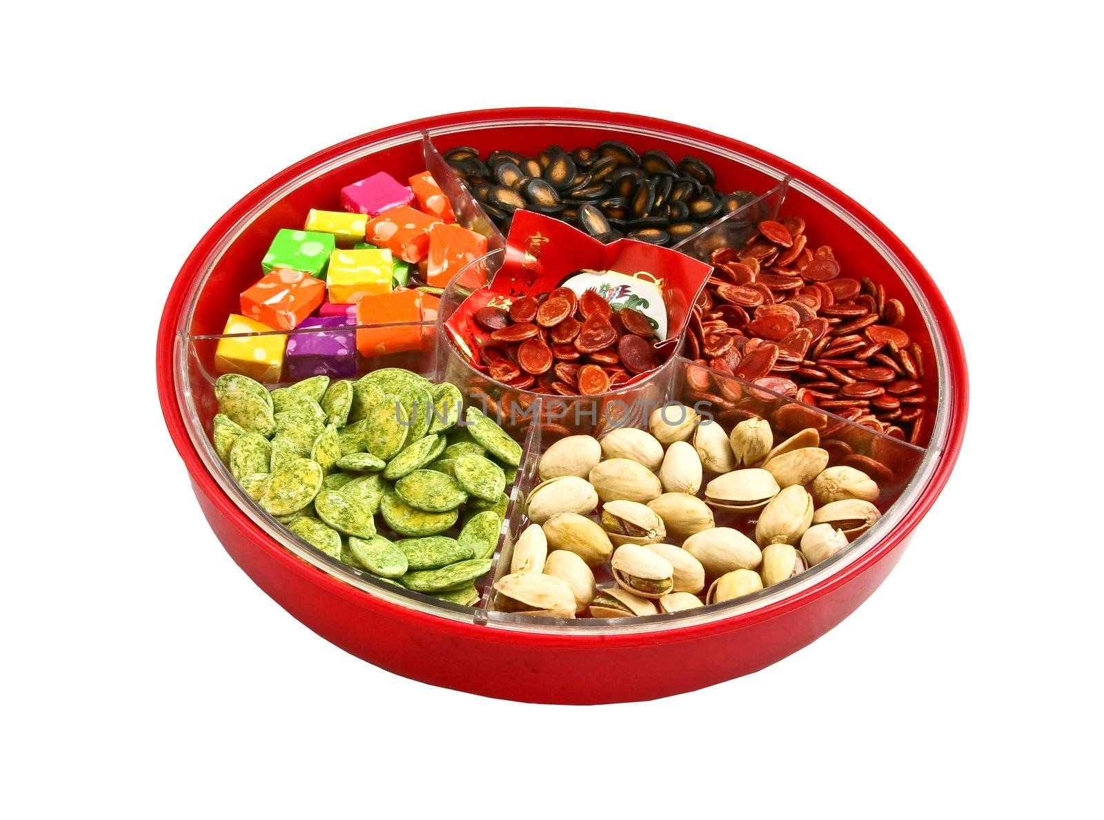 A top view of Chinese candy box. It is used for Chinese New Year, it consists different kinds of candies, chocolate coins, melon seeds, sugar preserved dried fruits or even dried vegetables.