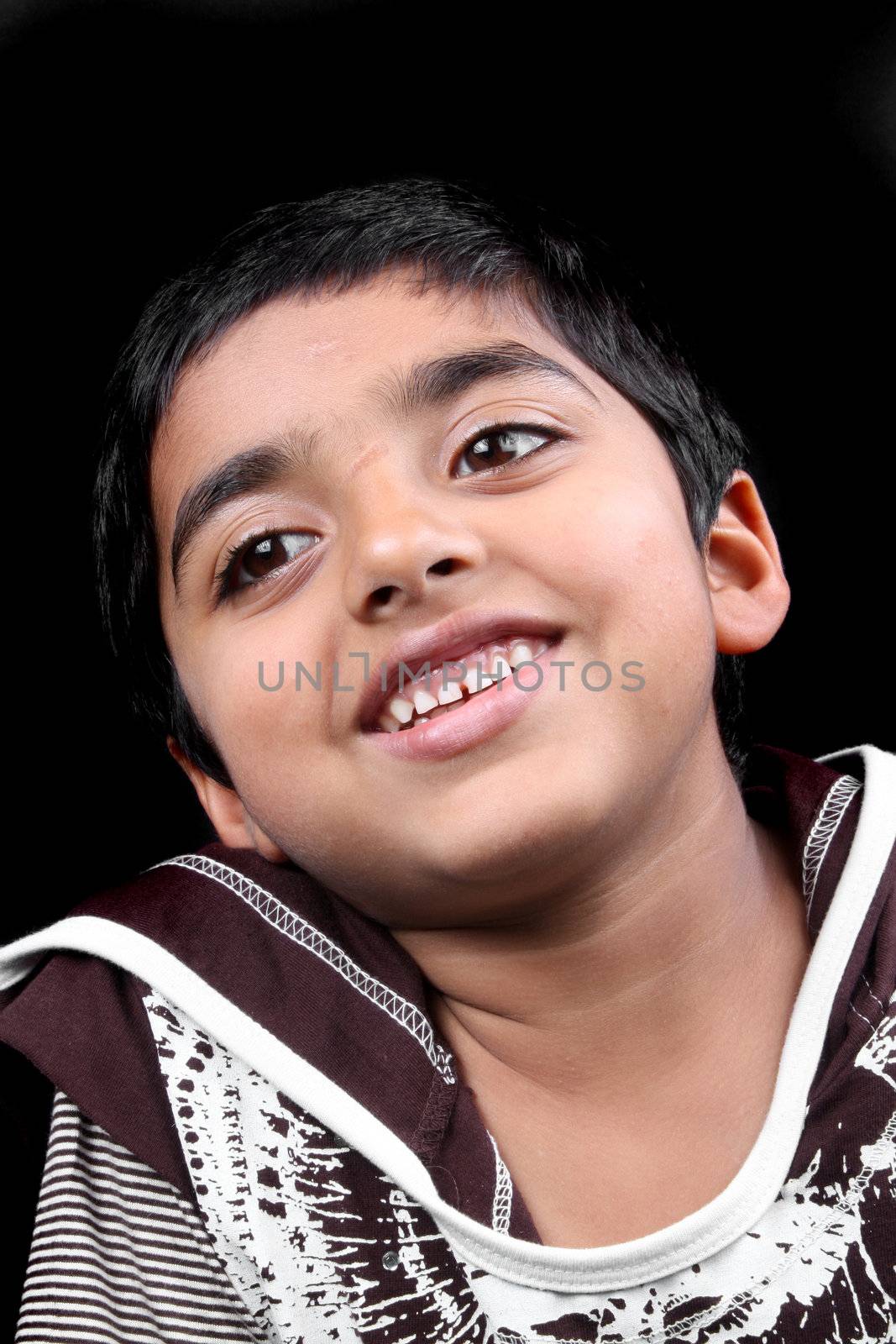 A portrait of a happy Indian kid.