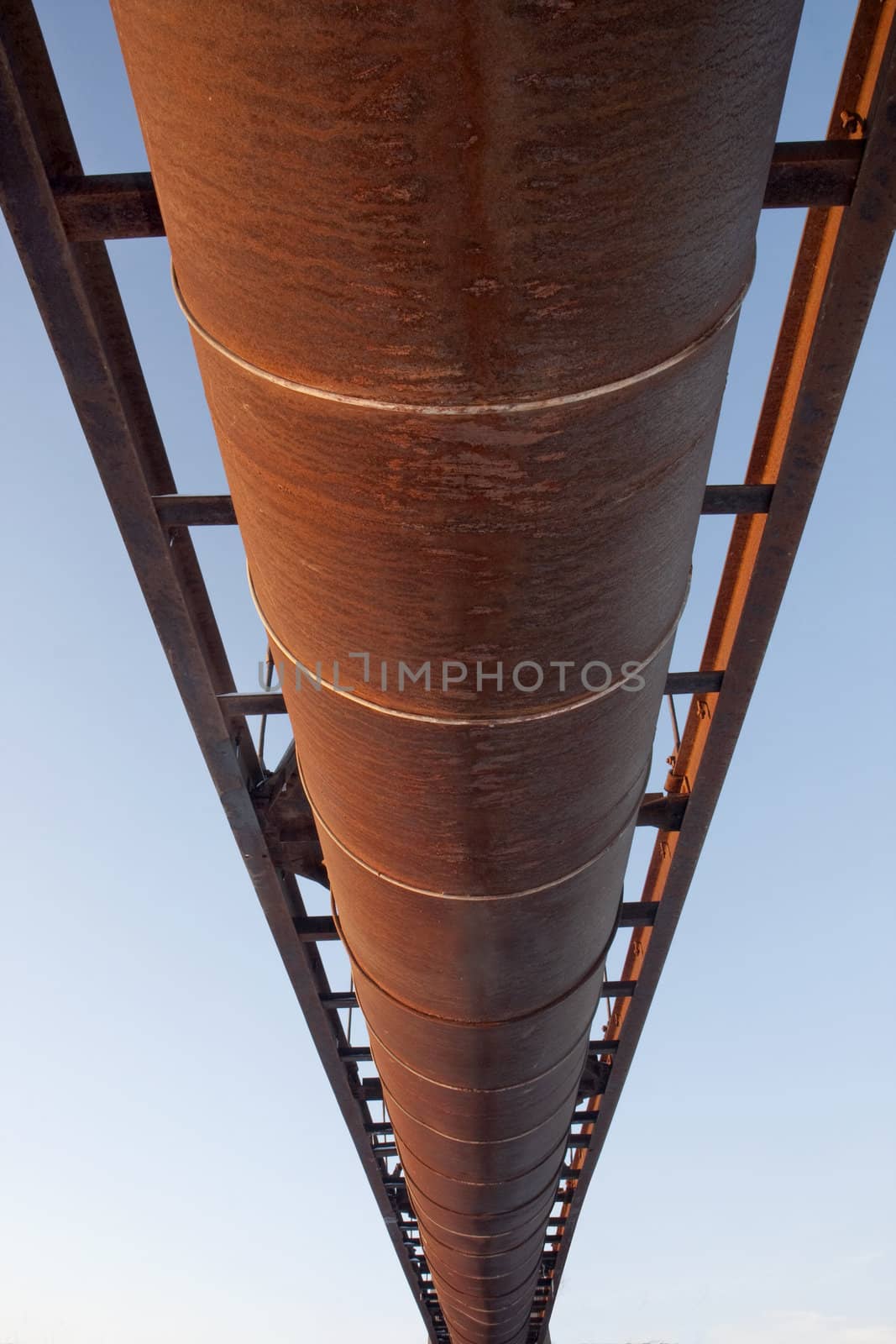 suspended rusty pipe shot from below by PixelsAway