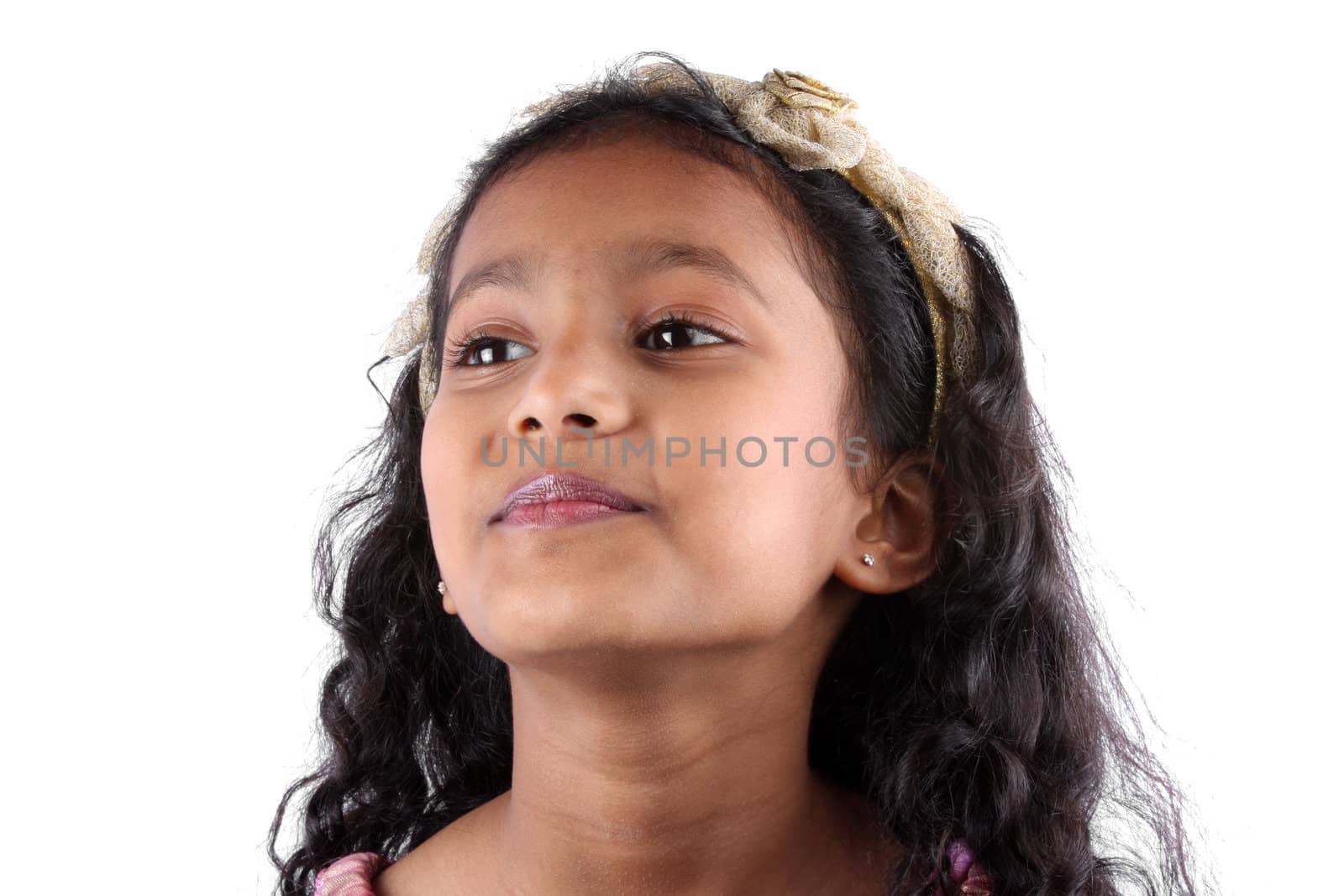 A portrait of a cute Indian girl, on white studio background.