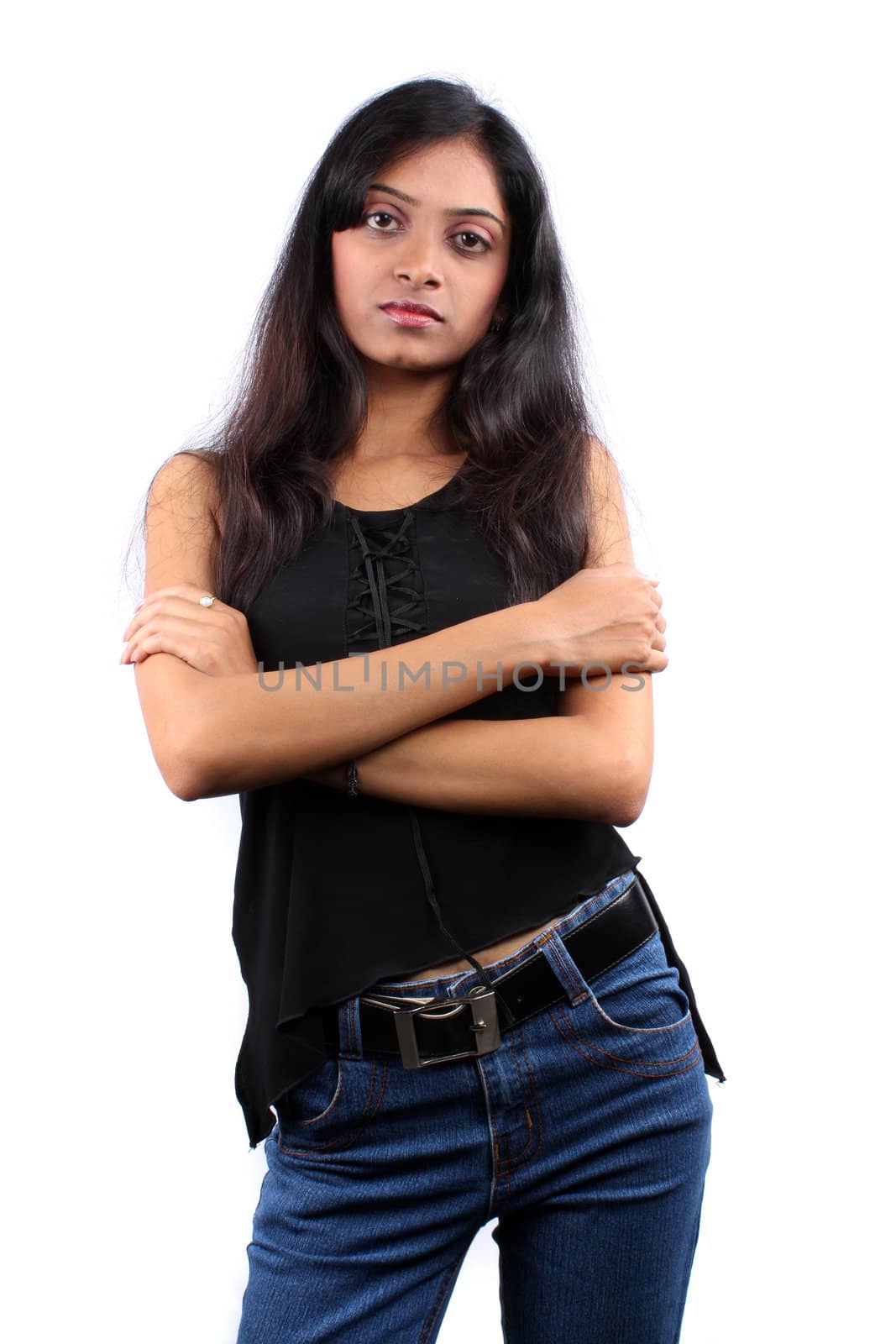A portrait of a stylish teenage Indian model, on white studio background.