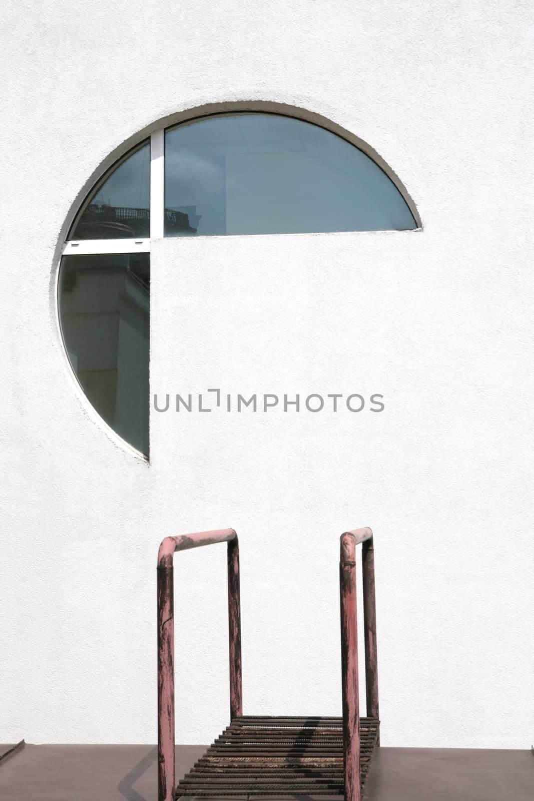 abstraction, architectral fragments of the modern building, futuristic window in concrete wall and metallic banisters