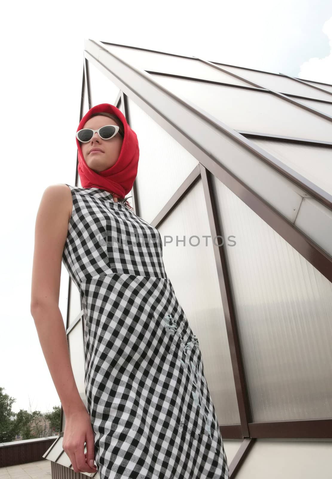 stylish girl in black sunglasses and red kerchief