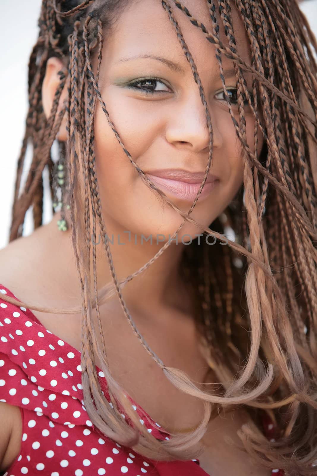 smiling extravagant girl with exotic hairstyle